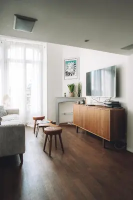a living room with a large flat screen tv at CANNES CENTRE VILLE- Bel appartement studio + Mezzanine in Cannes