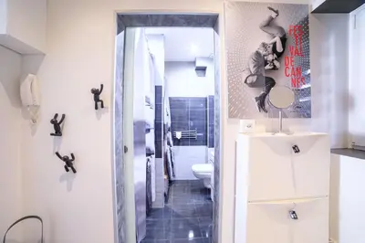 a bathroom with a toilet and a sink at 21 Rue Meynadier - Meynadier Duplex in Cannes