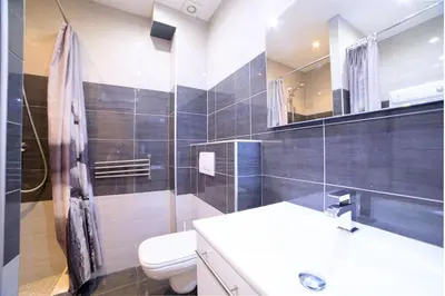 a bathroom with a toilet and a sink and a mirror at 21 Rue Meynadier - Meynadier Duplex in Cannes