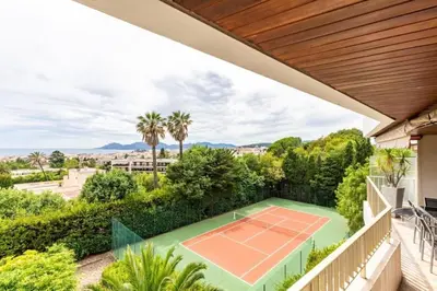 an estate with a tennis court on a balcony at Superbe 3 pièces avec piscine et tennis in Cannes
