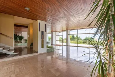 a lobby of a house with a palm tree at Superbe 3 pièces avec piscine et tennis in Cannes