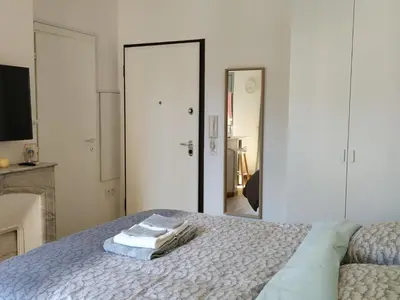 a bedroom with a bed with two towels on it at STUDIO CANNES A 5 MN A PIED DE LA GARE TOUT CONFORT AVEC BALCON in Cannes