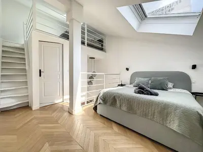 a bedroom with a bed and a skylight at Cannes : Duplex à 5 minutes à pied du Palais des Festivals in Cannes