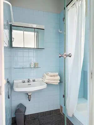 a blue bathroom with a sink and a shower at AGENCIA dernier étage vue mer panoramique in Cannes