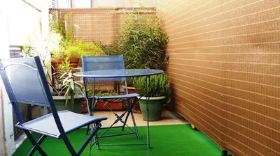 two chairs and a table on a small patio at STUDIOS PARISIENS in Cannes
