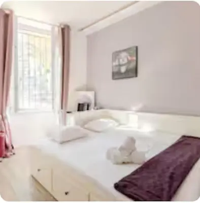 a white room with a bed and a window at Superbe 120m2 au Suquet - Property With Style in Cannes