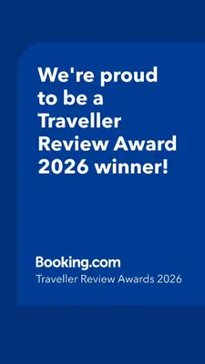 a blue sign that says were proud to be a traveller reviewagency winner at Bright and elegant renovated two rooms - Near Suquet in Cannes