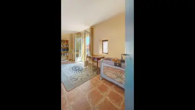 a living room with a couch and a table at Townhouse in the heart of the suquet - 4 bedrooms in Cannes