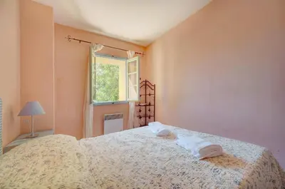 a bedroom with a bed with two towels on it at Townhouse in the heart of the suquet - 4 bedrooms in Cannes