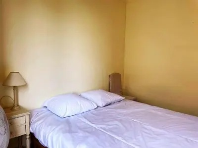 a bedroom with a bed with two pillows on it at C043-Agréable 3 Pièces proche Croisette et plages in Cannes