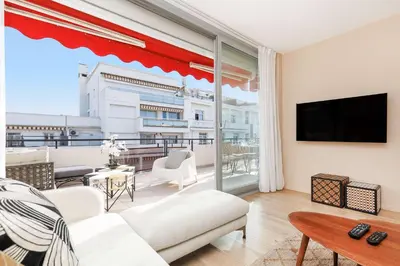 a dining table on the balcony of a apartment at XXL 2 beds with XXL terrace next to Martinez Hotel in Cannes