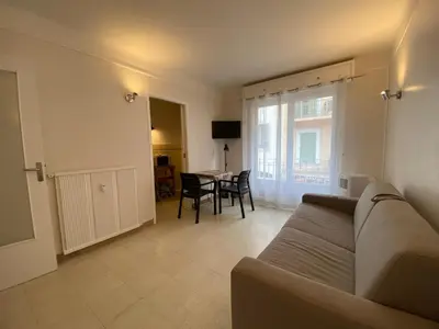 a living room with a couch and a table at C048 Studio Spacieux proche Plages et Palais in Cannes