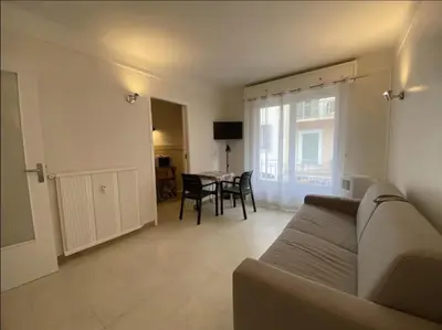 a living room with a couch and a table at C048 Studio Spacieux proche Plages et Palais in Cannes