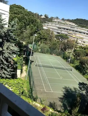 an overhead view of a tennis court in a city at Chagall 3 étoiles in Cannes