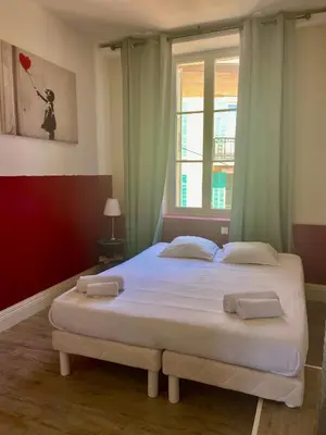 a bedroom with a bed with two towels on it at The Loft - Superb 2 bedrooms on top floor with terrace - 10min to Palais & Beach! in Cannes