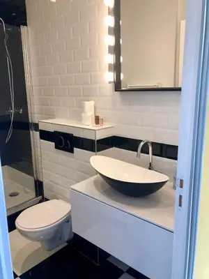 a bathroom with a sink and a toilet at The Loft - Superb 2 bedrooms on top floor with terrace - 10min to Palais & Beach! in Cannes