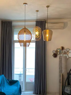a room with three lights and a window at Le somptueux Le Gallia in Cannes