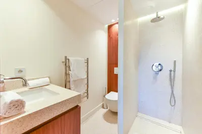 a bathroom with a shower and a sink and a toilet at Luxurious apartment with terrace 6P - 3BR - Grand in Cannes