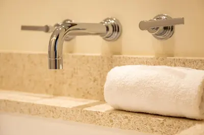a bathroom sink with a roll of toilet paper at Luxurious apartment with terrace 6P - 3BR - Grand in Cannes