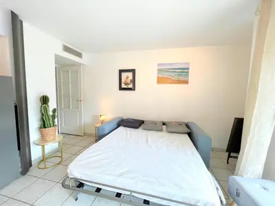 a bedroom with a bed in a room at Palazzio 3, quartier vieux port avec parking, by Welcome to Cannes in Cannes
