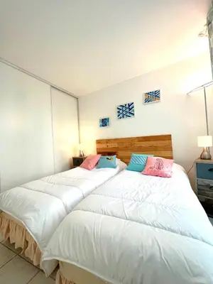 two beds sitting next to each other in a bedroom at Palazzio 3, quartier vieux port avec parking, by Welcome to Cannes in Cannes