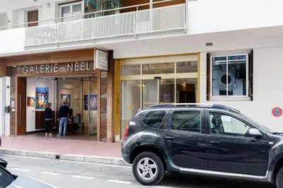 a black suv parked in front of a store at Palladium 148 YourHostHelper in Cannes