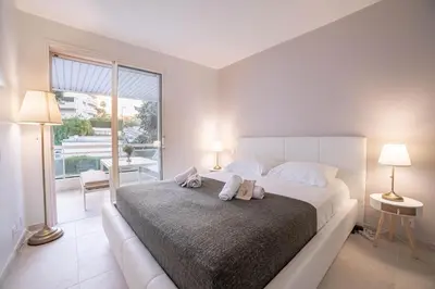 a living room with a table with a vase on it at Dream Apartment by Halldis in Cannes