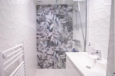 a bathroom with a sink and a shower at Dream Apartment by Halldis in Cannes