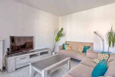 a living room with two couches and a tv at Appartement Berthelotine - Welkeys in Cannes