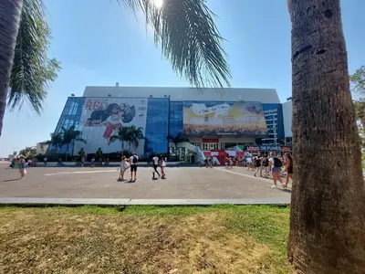 a building with an arch in a town with a tree at Place du Suquet - In the hart of old Cannes - 2 Min Walking distance from Palais de Festivals and Beaches in Cannes
