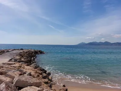 a group of people standing around a stage with a screen at Place du Suquet - In the hart of old Cannes - 2 Min Walking distance from Palais de Festivals and Beaches in Cannes