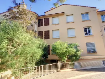 an apartment building with trees in front of it at 2 bedroom, 2 bathrooms Suquet with sea view 314 in Cannes