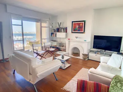 a living room with white furniture and a fireplace at 2 bedroom, 2 bathrooms Suquet with sea view 314 in Cannes
