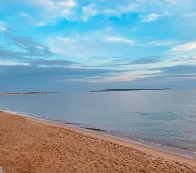 a view of the beach from the shore at Océan front apartment in Cannes