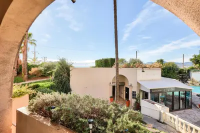 a view of a building from an archway at Résidence Cannes Verrerie - maeva Home - Appartement climatisé 2 pièces 4 personnes - Sélection MAE-2064 in Cannes