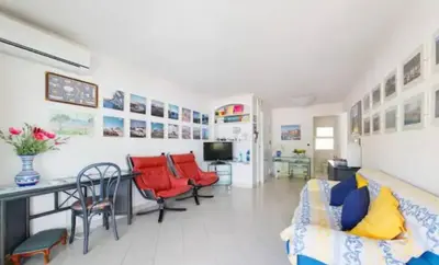 a living room with a couch and a table and chairs at Bright apartment - Cannes, la Croisette in Cannes