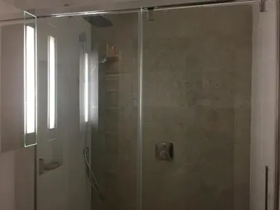 a shower with a glass door in a bathroom at Parc De La Croisette in Cannes