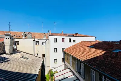 a group of buildings with roofs and a blue sky at Charming Studio ideal for Congresses and Holidays LIVE IN GAZAGNAIRE in Cannes