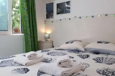 a bedroom with a bed with towels on it at Studio at -La Croisette- Cannes - BEACH GARDEN - in Cannes
