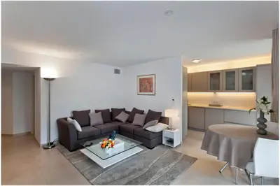 a living room with a couch and a table at REF 912 - Cannes Center - Apartment for rent in Cannes