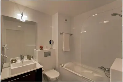a bathroom with a sink and a toilet and a shower at REF 912 - Cannes Center - Apartment for rent in Cannes