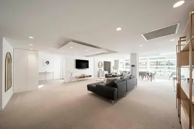 a living room with a couch and a table at REF 1071 - Cannes Center - 5mins to the Palais des Festivals in Cannes