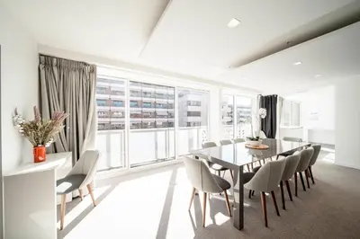 a dining room with a table and chairs and a large window at REF 1071 - Cannes Center - 5mins to the Palais des Festivals in Cannes