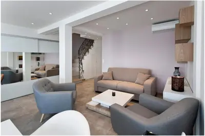 a living room with two couches and a table at REF 1229 - Cannes Croisette - Sea view apartment for rent in Cannes