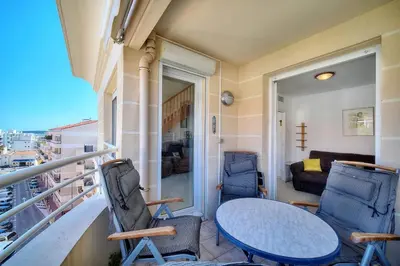 a balcony with a table and two chairs at REF 1766 - Cannes Center - Apartment for rent in Cannes
