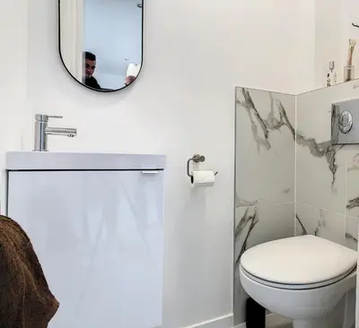 a bathroom with a toilet and a mirror at REF 1769 - Cannes - Sea view penthouse for rent in Cannes