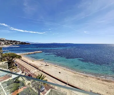 a view of a beach and the ocean at REF 1769 - Cannes - Sea view penthouse for rent in Cannes