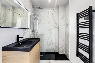 a bathroom with a black sink and a shower at REF 1769 - Cannes - Sea view penthouse for rent in Cannes