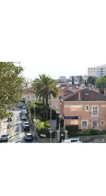 a view of a city street with cars and buildings at Évasion aux Portes de Cannes 100m2 Lumineux 2 Chambres Terrasse et Commerces in Le Cannet