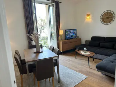 a living room with a couch and a table at Top emplacement centre Cannes in Cannes